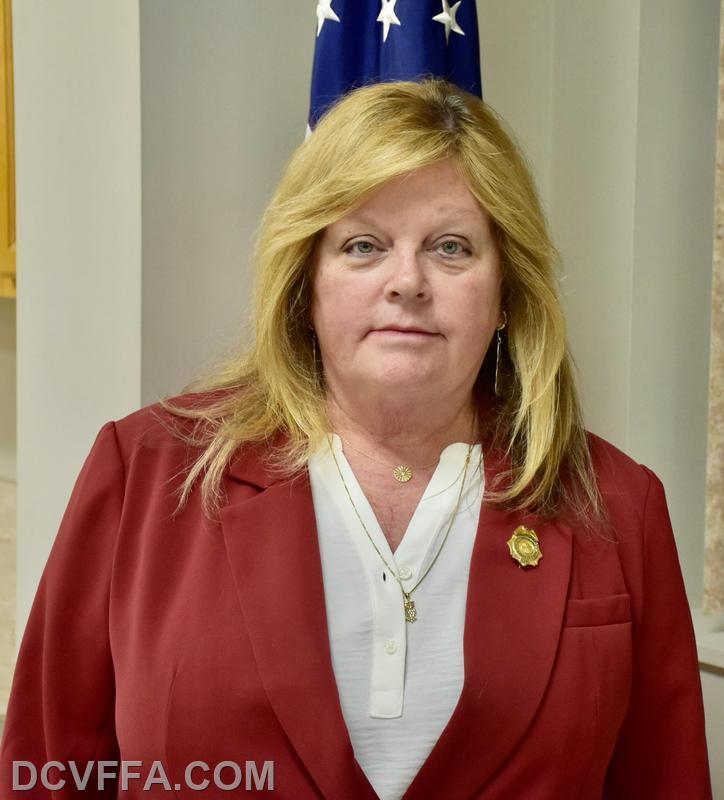                       Director  Kim Schmidt